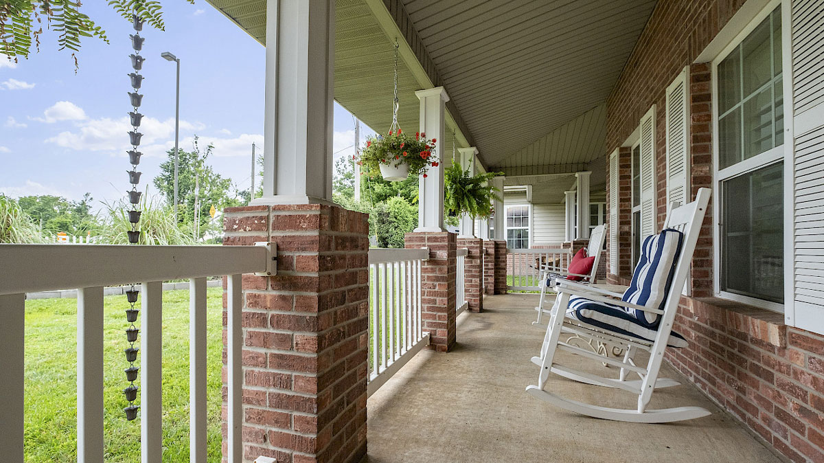 rocking chairs on patio looking out at garden